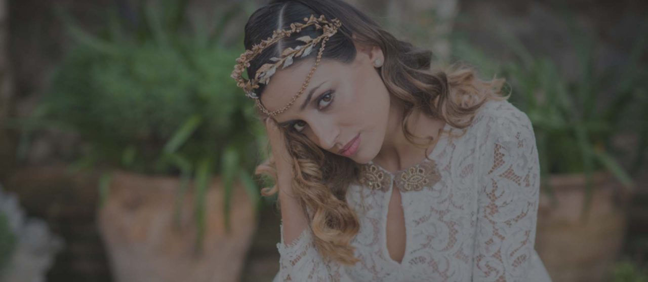 Bride with flower crown and lace dress by María Palomo Couture
