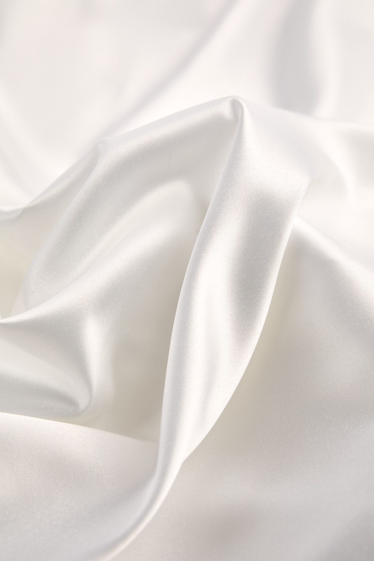 Close-up of the lightweight satin of the Lola bridal robe